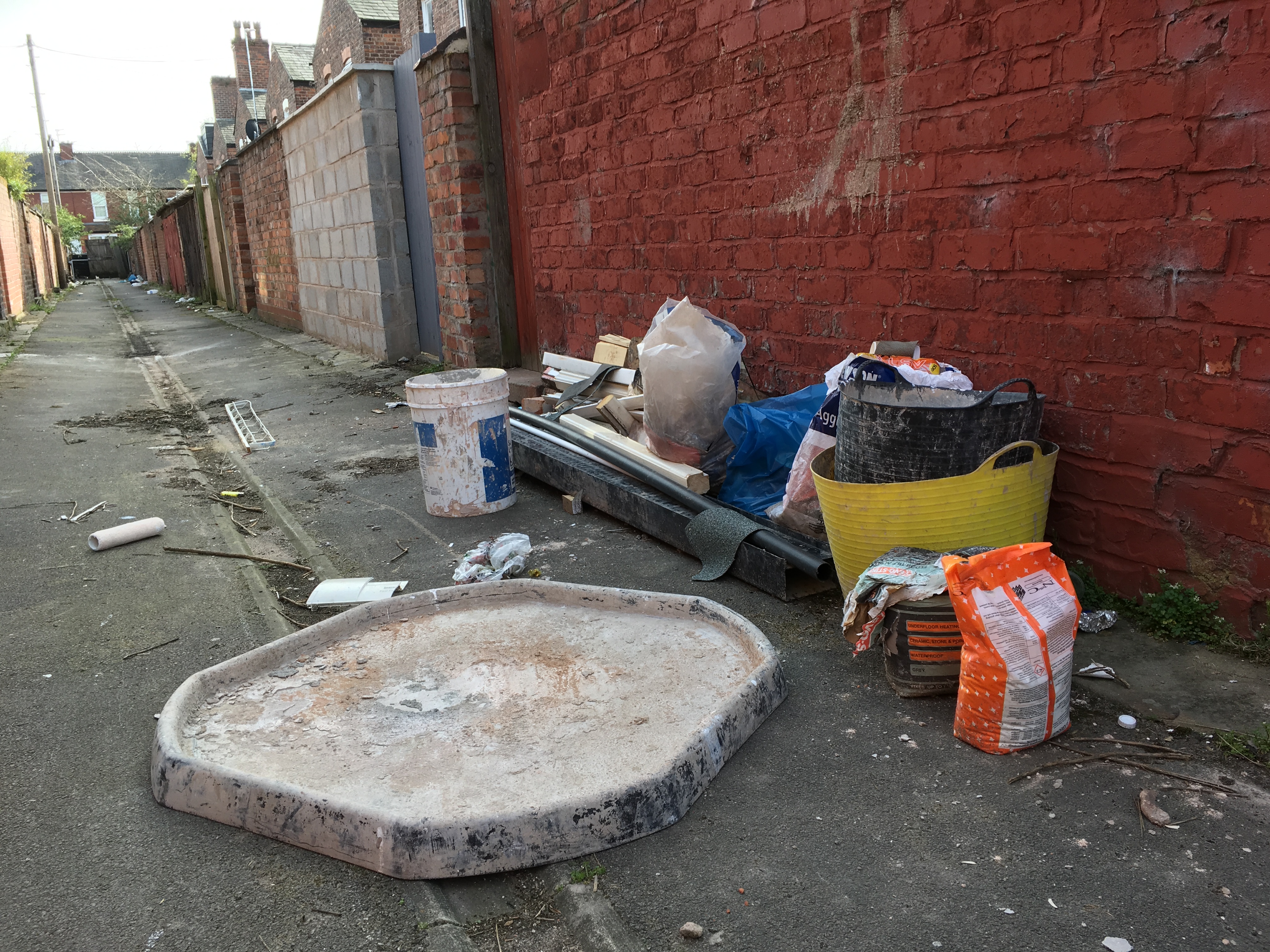 building waste dumped in a Manchester alley photograph