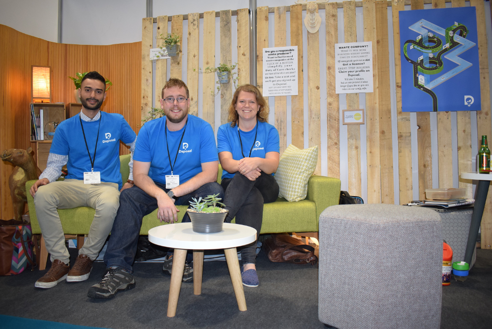 Dsposal's Developer Georgios Rovolis (left) with company founders Tom Passmore and Sophie Walker in their RWM 2018 exhibitors stand - Photo Credit Samuel McKeown Skip Hire Mag